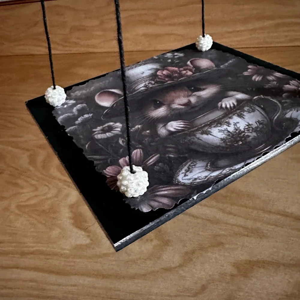 Handmade hanging display shelf with vintage mouse and teacup art